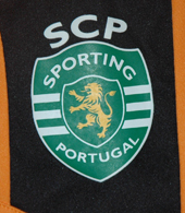 Sporting 2012/2013. 5-6 year old child size orange away mini kit