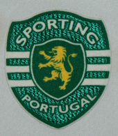Third jersey, shirt sleeved. This is a Puma sample. The crest looks more appropriate for a teddy bear than for a Sporting Lisbon official garment